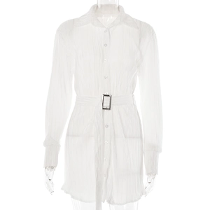 Detail of white button-down shirt dress with ruffled texture and belted waist detail