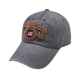 Detailed view of 3D embroidery on vintage washed dark grey baseball cap with US flag