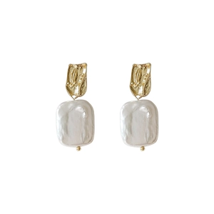 Baroque freshwater pearl earrings with hammered 14K gold plated metal on white background
