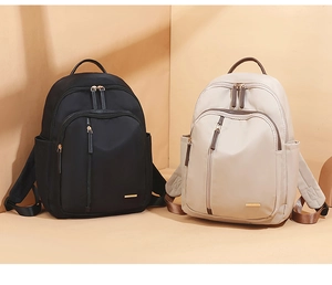 Comparación detallada de mochilas Oxford en negro y beige con múltiples bolsillos