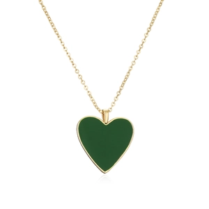 Close-up of a gold-plated necklace with a dark green heart pendant on white background