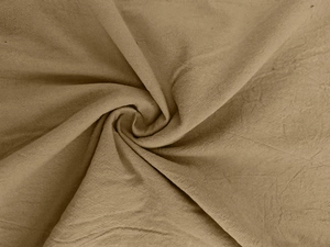 Detailed macro shot of breathable brown linen fabric showing texture and natural drape