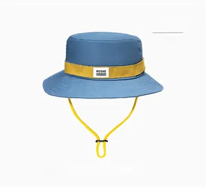 Detailed view of the adjustable yellow drawstring and sky blue canvas sun hat texture