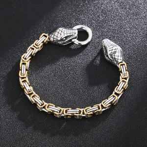 Close-up of retro stainless steel Byzantine chain bracelet with detailed snake head clasp