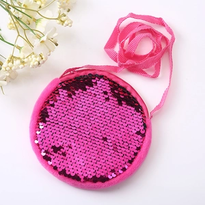 Pink plush kids crossbody bag featuring reversible pink and black sequins with zipper closure