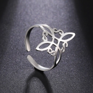 Detailed macro shot of a silver bow knot open adjustable ring in stainless steel