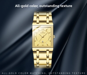 Detail of gold rectangular quartz watch with date window on blue silk background