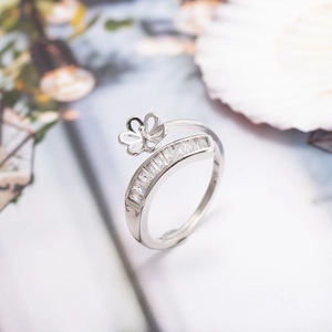 Adjustable ring with flower design and baguette-cut cubic zirconia in white metal finish