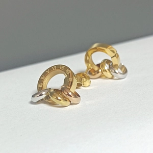 Three-tone roman numeral stud earrings in gold, rose gold, and silver stainless steel