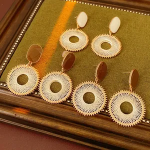 Vintage woven hoop earrings with grid pattern and oval enamel in gold and brown tones