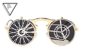 Detail of steampunk metal sunglasses with golden gear and bicycle wheel rim design