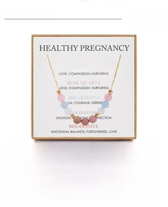 Detail view of handmade 18 inch pregnancy necklace with rose quartz and moonstone beads