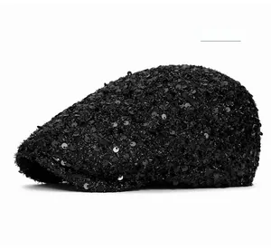 Detail of glitter black newsboy cap featuring shimmering sequins and retro beret style