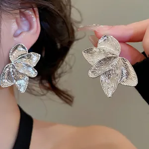 Silver oversized petal stud earrings with hammered leaf texture for women's jewelry fashion