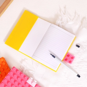 Portable A6 silicone notebook with yellow building block cover and creative grid pattern