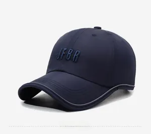 Detail of dark blue baseball cap with 3D embroidery and grey reflective brim edge