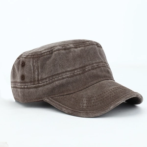 Detail of vintage distressed brown cotton army cap showing side eyelets and texture