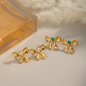 French vintage gold bow stud earrings with heart shaped white and green zircons