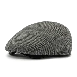 Classic grey checkered newsboy cap for men featuring warm wool texture and curved brim