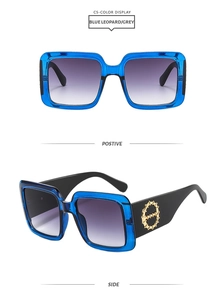 Blue square sunglasses with gradient grey lenses and gold chain temple detail