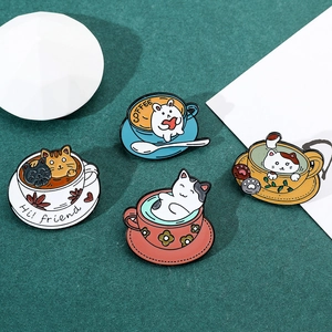 Detail of colorful alloy coffee cup enamel pins with cute cat and rabbit designs