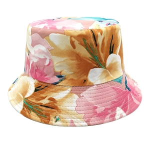 Detailed view of artistic floral print bucket hat with multi-row stitching on the brim