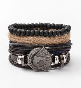 Detailed close-up of multi-layer leather bracelet featuring antique silver poker charm