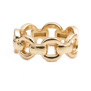Detailed macro view of the gold chain link design ring with a polished metallic finish
