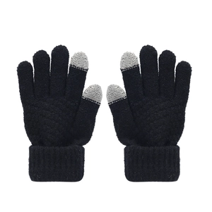 Close-up of black winter knit gloves with grey touchscreen tips and ribbed cuffs