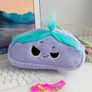 Close-up of a purple plush stationery bag with blue hair and funny embroidered face