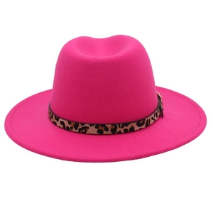 Detail of fuchsia wool fedora hat featuring leopard print band and golden ring buckle