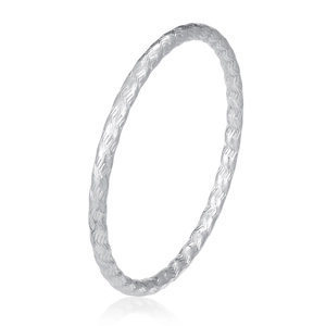 Detail of silver stainless steel bangle showing intricate woven texture and metallic finish