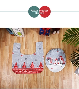 Detailed view of gray Christmas toilet mat set with festive reindeer and snowflake patterns