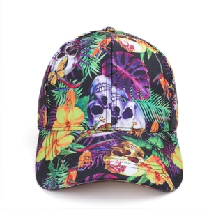 Detailed view of the vibrant skull and tropical leaf print on this casual baseball cap