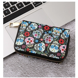 Detailed top view of a black PU leather wallet featuring colorful skull and flower prints