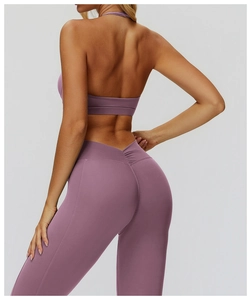 Detail view of v-shaped pleated waistband on dusty purple high-waist yoga leggings