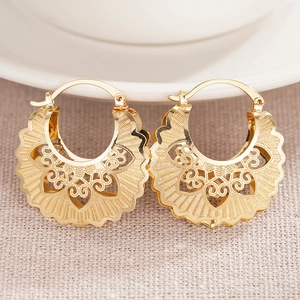 Vintage gold hollow-out fan-shaped earrings with intricate floral patterns and wavy texture