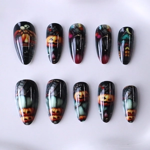 Halloween long almond press-on nails with pumpkin, haunted castle, and moon designs