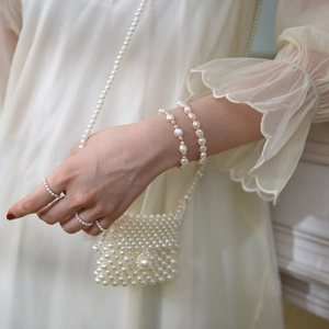 Macro detail of irregular freshwater pearls bracelet and ring with elegant luster