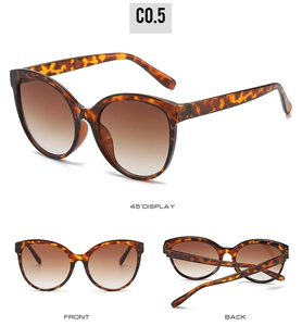 Three angles of tortoise shell cat-eye sunglasses with gradient brown lenses