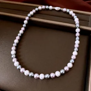 Elegant multi-color pearl necklace with white, grey and purple pearls in a velvet gift box