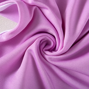 Detailed close-up of purple high-stretch knitted fabric texture for athletic yoga shorts