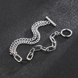 Detail of silver stainless steel Cuban chain bracelet with OT toggle clasp closure