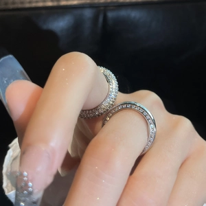 Minimalist silver zircon open rings with micro-pave setting on dark leather background