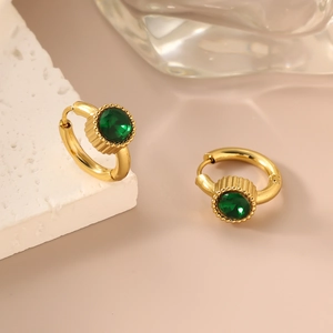 Detail of 18K gold-plated stainless steel hoop earrings with green zircon on white stone