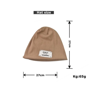 Size detail of khaki beanie with measurements 27cm by 27cm and 65g weight specification
