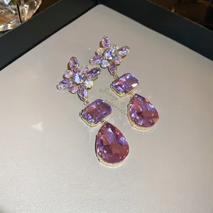 Elegant purple crystal teardrop earrings with floral design and gold setting