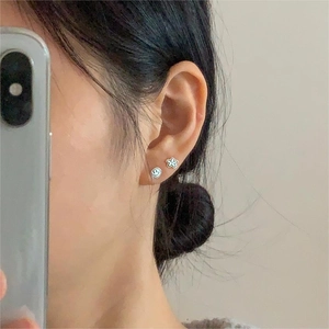 Close-up of minimalist S925 silver star flower and smiley face stud earrings set