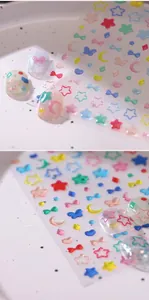 Detailed 3D embossed nail stickers featuring stars, moons, and glitter candy tones