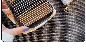 Detail view of anti-demagnetization leather card holder with large capacity accordion slots